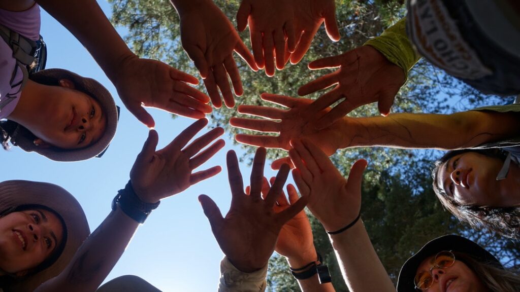 Ground of hands together from students on a Wilderness experience with Environmental Traveling Companions