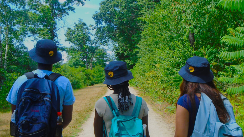 Summer Searchers looking down a path in nature.