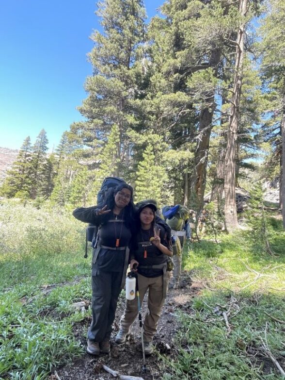 Two students wearing convertible hiking pants provided by Redwood Trading Post!