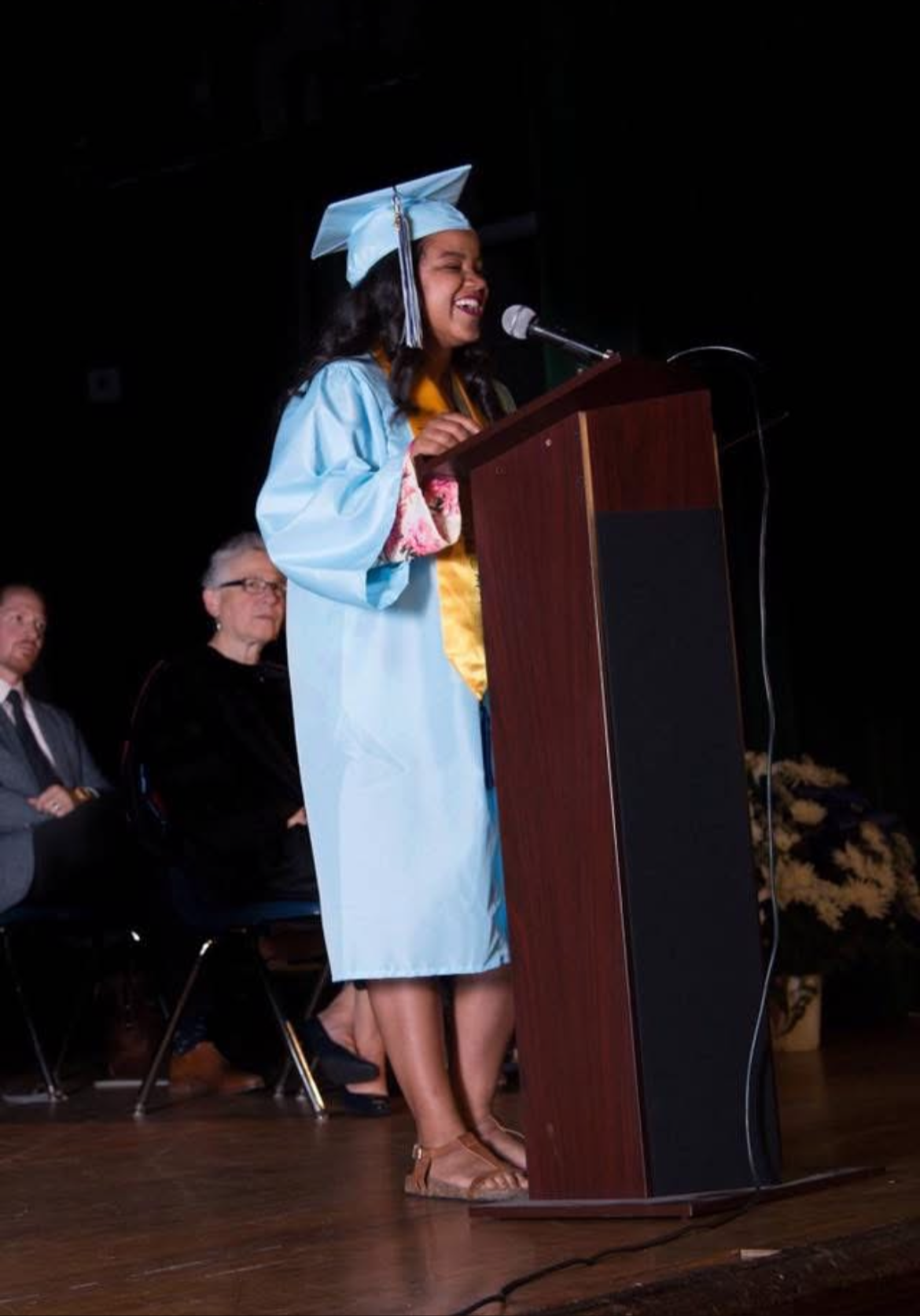Shakya speaking at her high school graduation